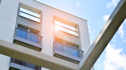 Modern apartment buildings on a sunny day with a blue sky. Facade of a modern apartment building
