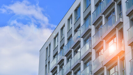 Modern apartment buildings on a sunny day with a blue sky. Facade of a modern apartment building