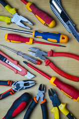 Different types of tools screwdrivers, pliers, nippers.