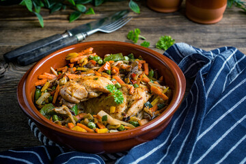 Fried chicken fillet with vegetables.