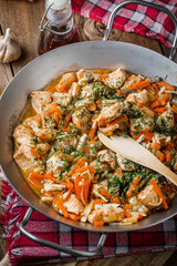 Fried chicken pieces with vegetables.