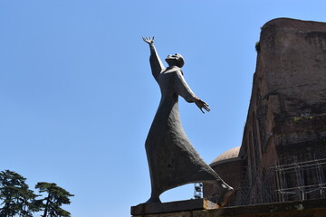 given to fly statue rome