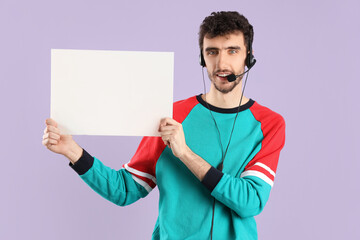 Male technical support agent with blank poster on lilac background