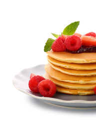 Plate with sweet pancakes and berries on white background, closeup