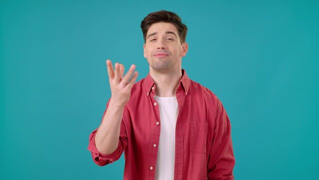 Smiling man makes chef kisses showing approval gesture