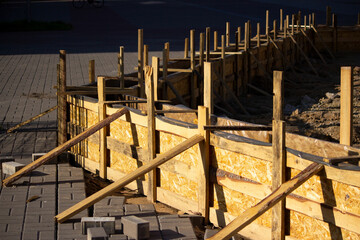 temporary wooden formwork built for pouring concrete and forming walls of architectural forms for lawns.