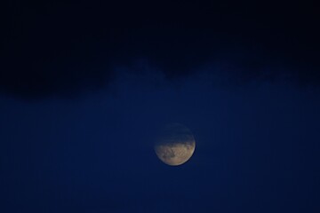 moon and black clouds in the night dark sky