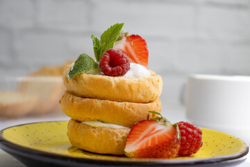 Bread with strawberries, mint on a light background