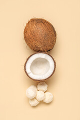 Coconut and white chocolate candies on beige background