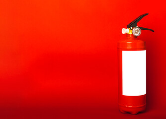 Fire extinguisher on red texture background. Fire protection, home fire extinguisher. home security concept. Place for text. Copy space.banner