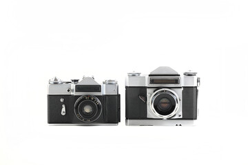 Very rare old 35 mm SLR cameras on white background.