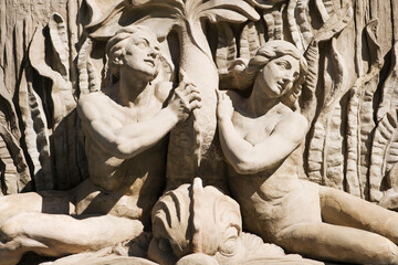 stone statue man woman