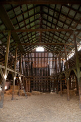 a barn with bales of hay