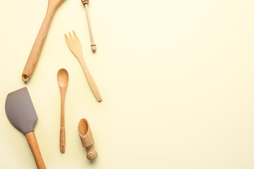 Composition with different kitchen utensils on color background