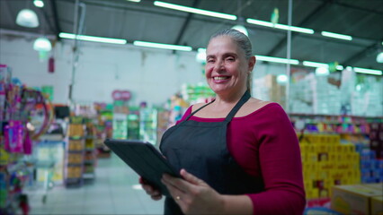 Female Staff of Supermarket with Tablet, Smiling happy Expression, Middle-Aged Employee Inside Business