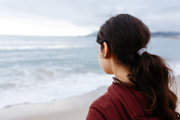 rear view of girl head watching the sea
