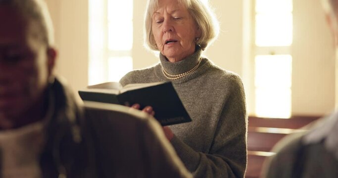 Senior woman, church and singing with worship, praise and hymn book in faith, religion or reading. Elderly Christian lady, focus and holy song in sermon, respect or harmony with spiritual mindfulness