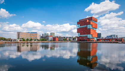 Antwerp skyline at port, Belgium. Panoramic view of buildings reflecting in the water.