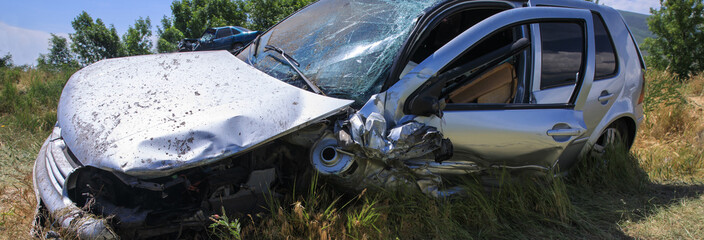 broken car in grass
