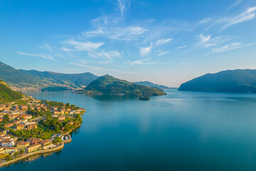 Fototapeta premium Marone, Lake Iseo. Aerial panoramic sunset view of Marone town surrounded by mountains and located in Iseo Lake, Brescia, Lombardy, Italy