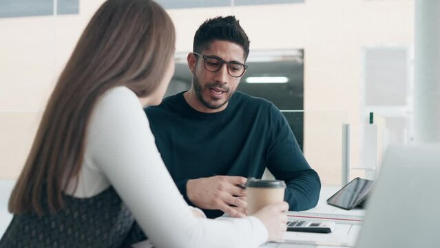 Video of two smart entrepreneurs  team talking while working together in a coworking place