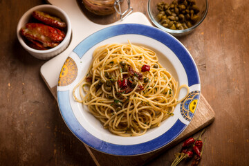spaghetti with anchovies dried tomatoes and capers