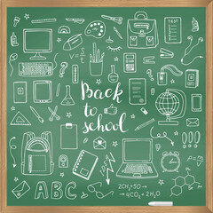 A set of school supplies and lettering Back to doodle School. The objects are drawn with chalk on the blackboard.