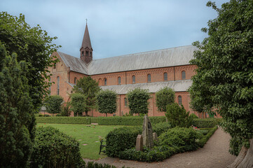 Fototapeta na wymiar Sorø Abbey Church and the surrounding graveyard, Sorø, Denmark, July 29, 2023