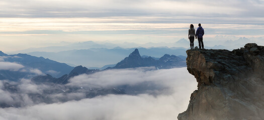 Epic Adventure Composite of Hikers on top of a rocky mountain.