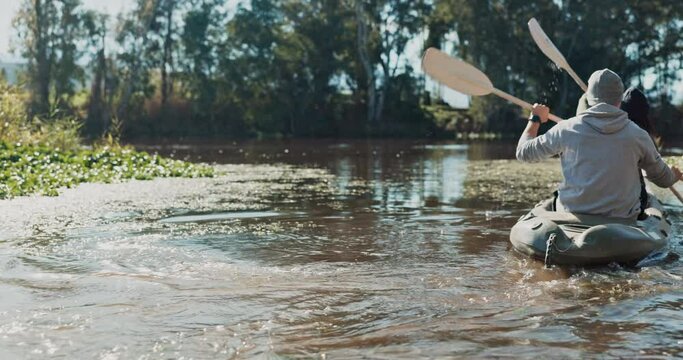 Kayak, lake and people on an adventure to explore the water and friends rowing in nature together for a journey. Boat, canoe and person in river for vacation or holiday in the countryside for freedom