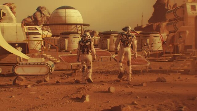 Two astronauts in spacesuits walk toward research station, colony or scientific base on Mars. Solar cell and panels. Space mission on red planet. Futuristic colonization and space exploration concept.