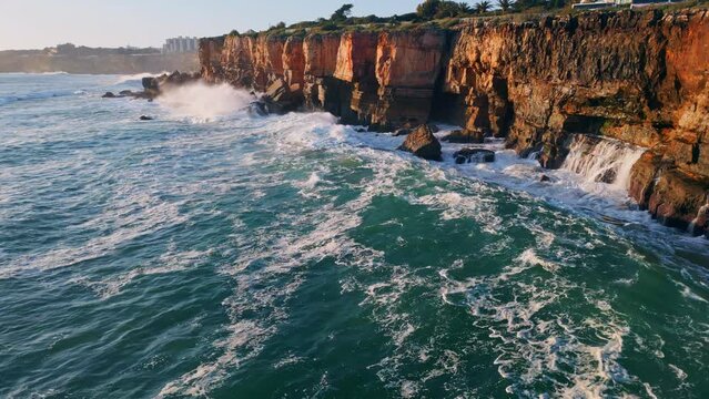Dangerous rough coastal cliffs washed stormy ocean water aerial view. Huge waves