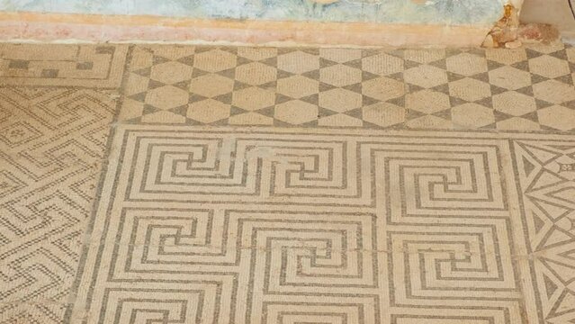 Casa del Mitreo in Merida, Spain whispers tales of ancient Rome, where stone pillars and mosaic patterns echo past lives