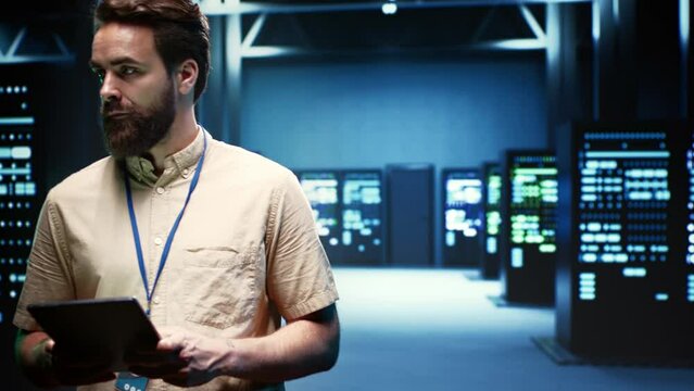 Expert preparing server room recovery plan monitoring data center energy consumption across components, ensuring sensors are functioning optimally, performing routine disk checks