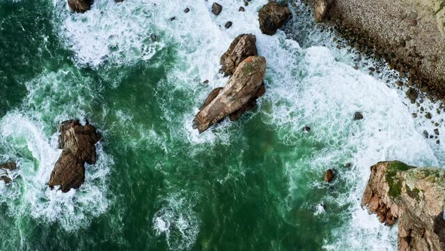 Aerial view of green scenic cliffs and fantastic rocky coast, Cabo da Roca, Portugal, the most westerly point of the European mainland. Top view