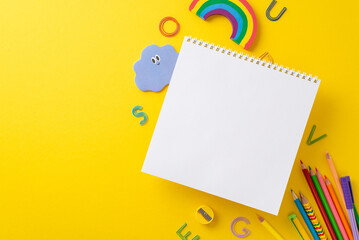 Learning essentials arrangement. Overhead view image featuring empty album page and an abundance of...