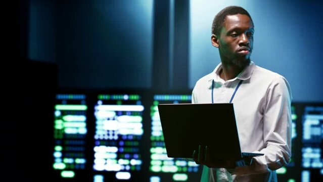 IT developer setting up data center advanced firewalls, intrusion detection systems and regular security updates. Cybersecurity expert preventing hacking, malware, and DDoS attacks