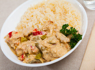 Fototapeta na wymiar Thai Red Curry served with rice on plate