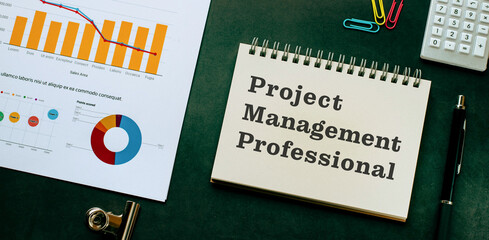 There is notebook with the word Project Management Professional. It is as an eye-catching image.