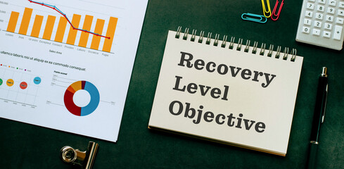 There is notebook with the word Recovery Level Objective. It is as an eye-catching image.
