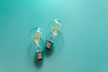 Electricity and energy saving concept.Energy saving light bulbs on a blue background