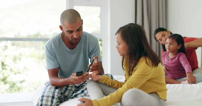 Diabetes, insulin and a father testing his daughter to monitor her blood sugar level for daily healthcare. Family, children and a man using a glucometer on a female kid in the bedroom of their home