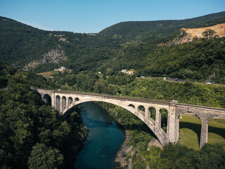 Fototapeta na wymiar Solcan Bridge over River Soca, Slovenia. Aerial view.