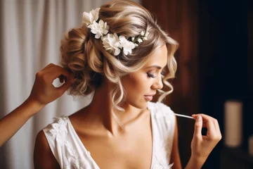 Foto auf Acrylglas Schönheitssalon Hairdresser making an elegant hairstyle styling bride with white flowers in her hair