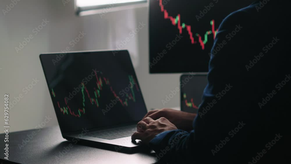 Aufkleber Back view of stock market broker in analyzing data and graphs on multiple computer screens while sitting in modern office.