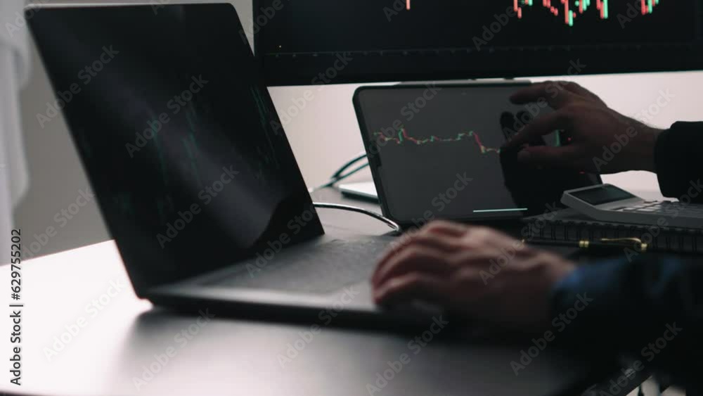 Aufkleber Back view of stock market broker in analyzing data and graphs on multiple computer screens while sitting in modern office.