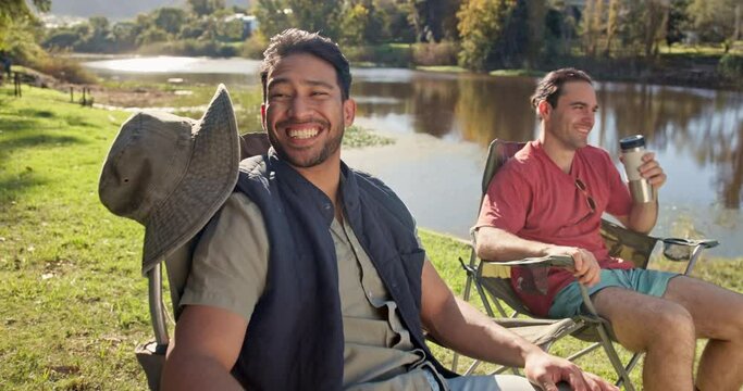 Friends, talking and camping chair in nature, lake or countryside for relax vacation and holiday. Happy, social and group of people or men in conversation for natural carbon footprint by forest river
