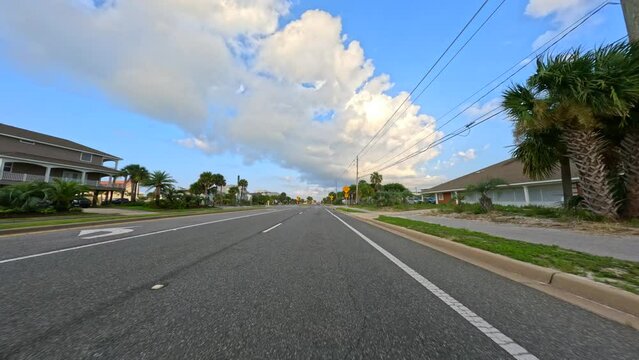 4k driving stock footage Pensacola Beach Florida residential homes on both sides of the road