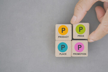 4Ps, Product, Price, Place, Promotion,  text on wooden cube blocks on grunge grey background...