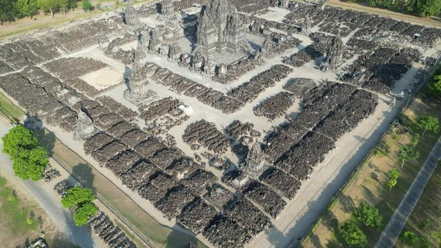 Aerial view of Candi Sewu Buddhist Temple near Prambanan Hindus temple in Central Java, Indonesia. The biggest Buddhist temple after Borobudur with Stone fragments scattered on the ground - 4k Footage
